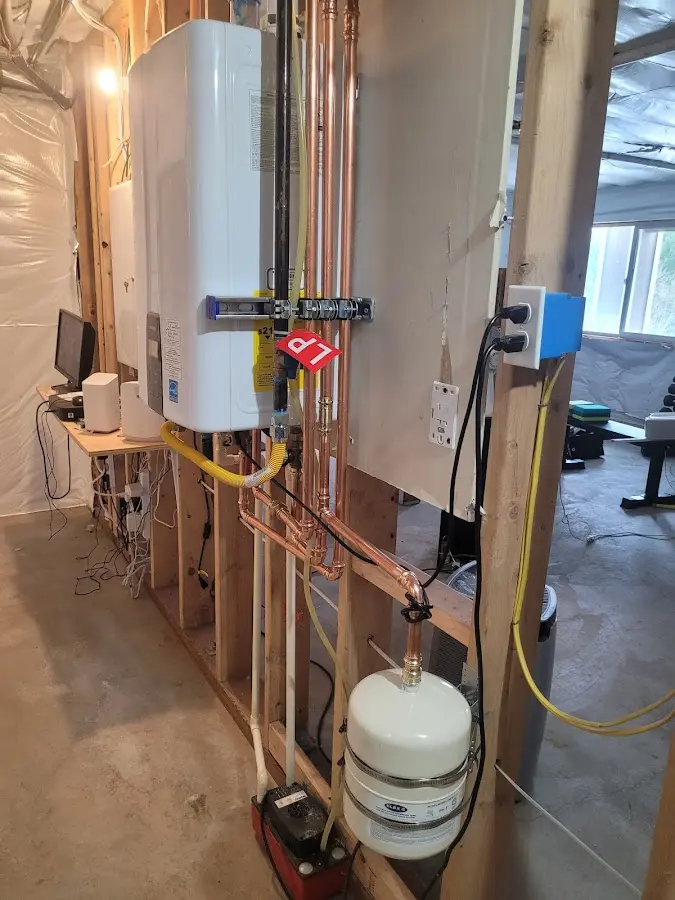 Licensed plumber repairing a kitchen sink in Hampstead